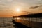 Picturesque seaside resort town in Slovenian coast against orange sunset sky in summer.