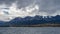 Picturesque snow-capped mountain range of the Andes- Martial against a cloudy sky.