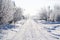 Picturesque snow-covered road in the countryside in winter