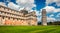 Picturesque spring view of famous Leaning Tower in Pisa. Sunny morning scene with hundreds of tourists in Piazza dei Miracoli