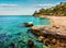Picturesque spring view of Kanoni Beach. Marvelous evening seascape of Ionian Sea. Spectacular outdoor scene of Kassiopi village