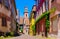 Picturesque street with charming houses in Riquewihr