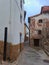 Picturesque street with flower pots on the facades of a white village of Montanejos, Castellon de la Plana