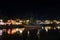 Picturesque Street with Lanterns, River and Boats in the Evening