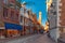 Picturesque street and tower Belfort in Bruges