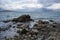 Picturesque summer Arctic seascape. View from the rocky shore to the sea bay.