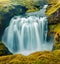 Picturesque summer scene of waterfall on Skoga river. Stunning summer view from the tourist trek from famous Skogafoss waterfall t