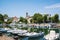 Picturesque summer view of the pier with ancient and modern buildings, yachts and other boats in Rimini, Italy - June 21, 2017