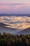 Picturesque sunrise morning in mountains above clouds, Carpathians, Ukraine.