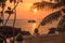 Picturesque sunset near the sea with coconut palm tree, orange sun, boat and clouds. Phu Quoc, Vietnam.