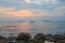 Picturesque sunset near the sea with ships, horizon and orange clouds. Phu Quoc, Vietnam.