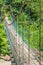 Picturesque suspension bridge on a mountain river