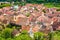 The picturesque town of Kaysersberg, featuring a collection of small houses among lush green fields