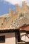Picturesque town in Spain. Ancient houses and defending wall. Al