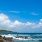 Picturesque tropical beach with coastal rocks