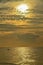 A picturesque tropical grey coloured nimbostratus cloudy coastal sunrise seascape in a yellow sky. Thailand