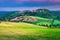 Picturesque Tuscany cityscape with grain fields, Monticchiello, Italy, Europe