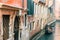 Picturesque view of ancient buildings, bridge and channel with gondolas in Venice, Italy. Beautiful romantic italian city.