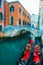 Picturesque view of ancient buildings, bridge and channel with gondolas in Venice, Italy. Beautiful romantic italian city