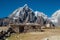 Picturesque view authentic tibetan habitation and stone fence in the Khumbu region in Nepal with majestic Taboche mountain 6501m