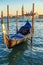 Picturesque view of blue gondolas in Venice, Italy.