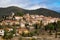 Picturesque view of Cucugnan commune with main landmark 17th-century windmill, Aude department, southern France