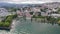 Picturesque view of Lausanne city on shore of Lake Geneva on background of mountains on summer day, Switzerland