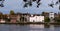 Picturesque view looking north across the River Thames between Chiswick Bridge and Kew Railway Bridge, London UK