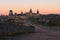 Picturesque view of medieval Kamianets-Podilskyi castle during autumn sunrise.