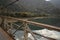 Picturesque view of metal bridge over river in mountains