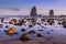 Picturesque view of the Oregon Coast with it`s sea stacks and rocks in the water after sunset.