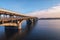 Picturesque view over the Metro Subway Bridge over the Dnipro river in Kyiv, Ukraine. Sunrise at winter morning