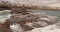 A picturesque view of rocks and stormy waves