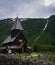 Picturesque view of Roldal Stave Church perched on the side of a mountain