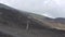 Picturesque volcanic landscape Mount Etna view from cableway, Etna national park, Sicily, Italy. Smoke and clouds, footage in