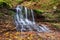 Picturesque waterfall on a mountain stream in a forest. One of the cascade of Rusiliv waterfalls. Rusylov, Ternopil region,