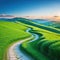 picturesque winding path through green grass in hilly areat under the blue