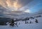 Picturesque winter windy and cloudy morning alps. Ukrainian Carpathians highest ridge Chornohora with peaks of Hoverla and Petros