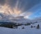 Picturesque winter windy and cloudy morning alps. Ukrainian Carpathians highest ridge Chornohora with peaks of Hoverla and Petros