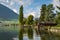 Picturesque wooden boat house on a lake shore