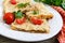 Pie, casserole pita with mushrooms, cottage cheese and cheese on a white plate on a wooden background.