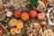 Pie with cherry tomatoes, pumpkin pie, orange and paper bag with nuts