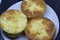 Pie with chesee on a white plate. Sponge cake with black background.