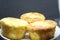 Pie with chesee on a white plate. Sponge cake with black background.