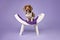 Piebald Dachshunds sitting on a curved bench