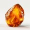 Piece of amber stone, a single amber crystal on white background.
