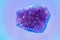 Piece of Amethyst (a violet variety of quartz) on the light surface