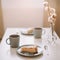 Piece of apple pie on plate with cup of coffee. Breakfast with coffee and cake in cafe. Food photography Table top photo