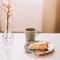 Piece of apple pie on plate with cup of coffee. Breakfast with coffee and cake in cafe. Food photography Table top photo