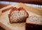 Piece Banana bread on table in cafeteria, soft focus